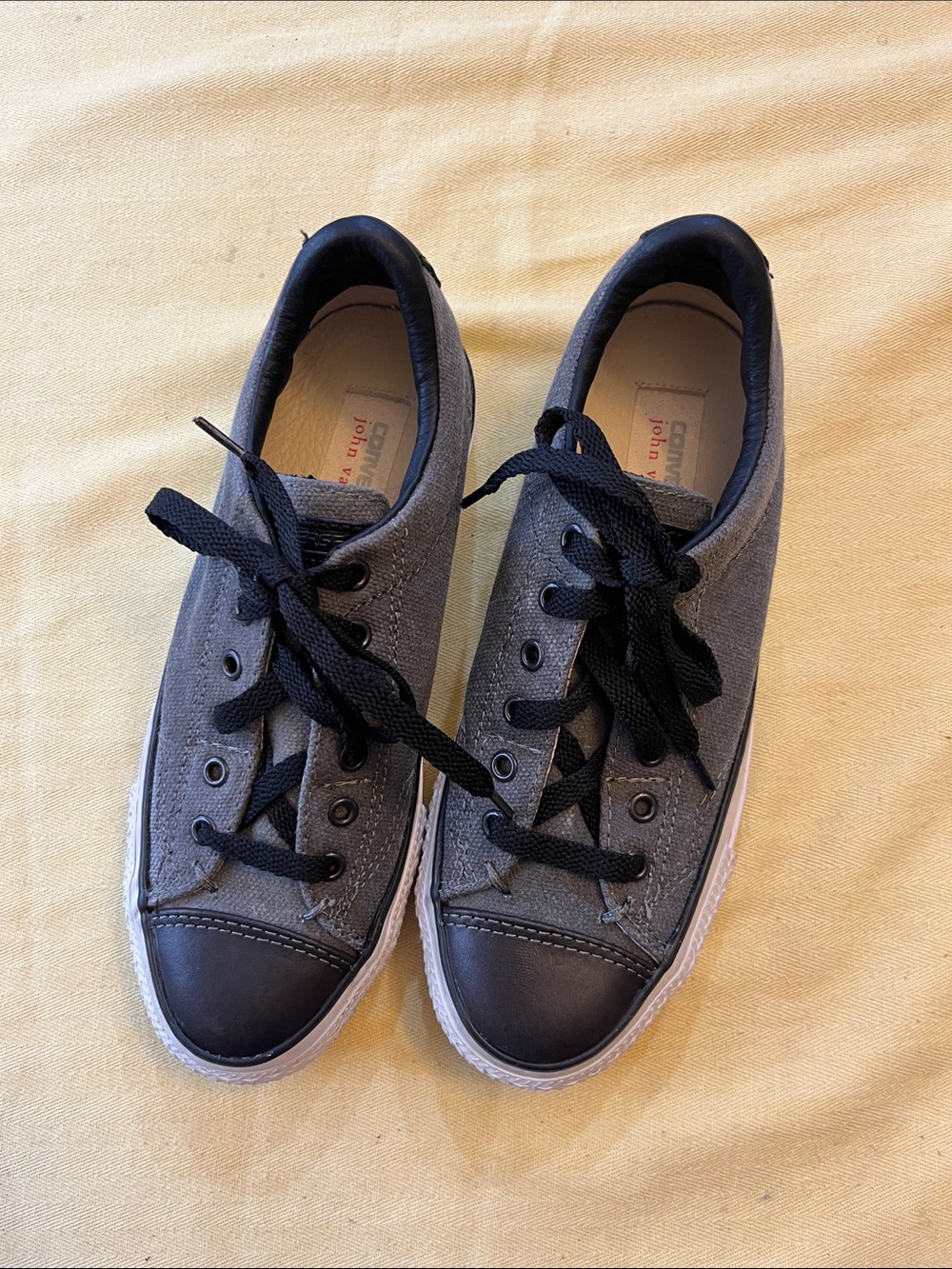 Converse women’s Gray Canvas Sneakers with Black Toe Caps